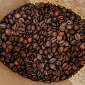 brown coffee beans on brown paper